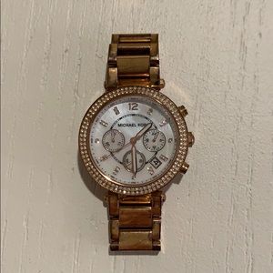 Michael Kors rose gold watch.